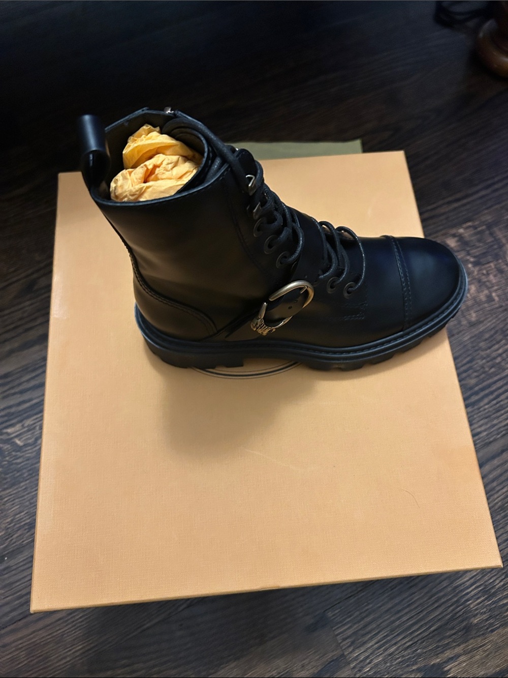 Tod's Black Leather Lace-Up Combat Boot with Gold Buckle Accent